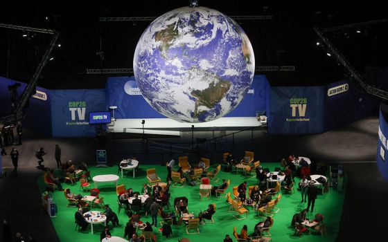 People attend the U.N. Climate Change Conference in Glasgow, Scotland, Nov. 12. (CNS/Reuters/Yves Herman)